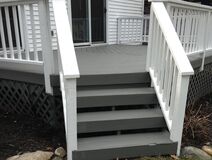 Gray painted deck with bright white painted rails