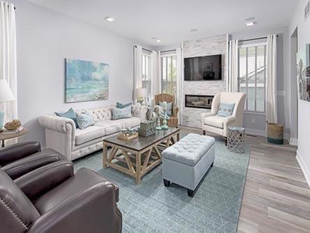 Interior modern glam design living room that has walls painted with a light gray color and bright white trim. 